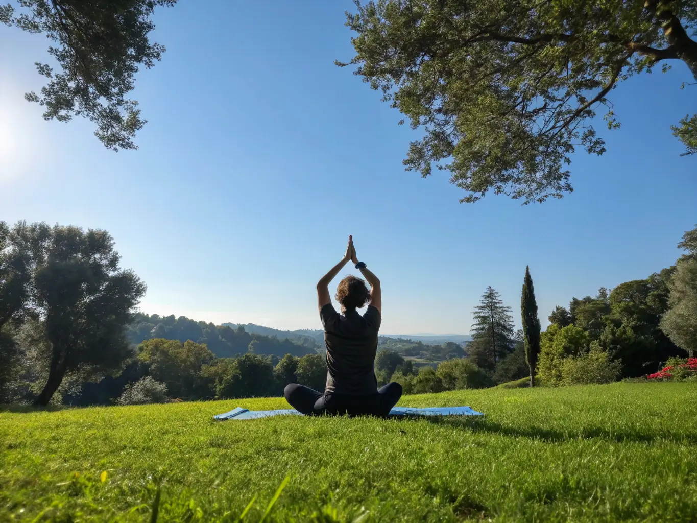 A person practicing yoga outdoors with a coach guiding via video call, representing the wellness and overall health coaching services provided by Trenmax.